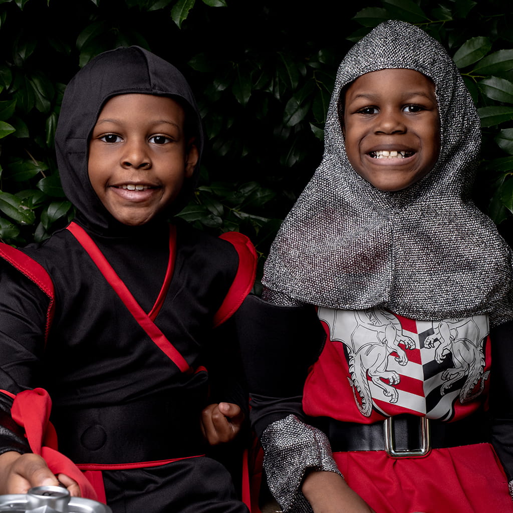 Two boys dressed up like ninjas for Halloween.